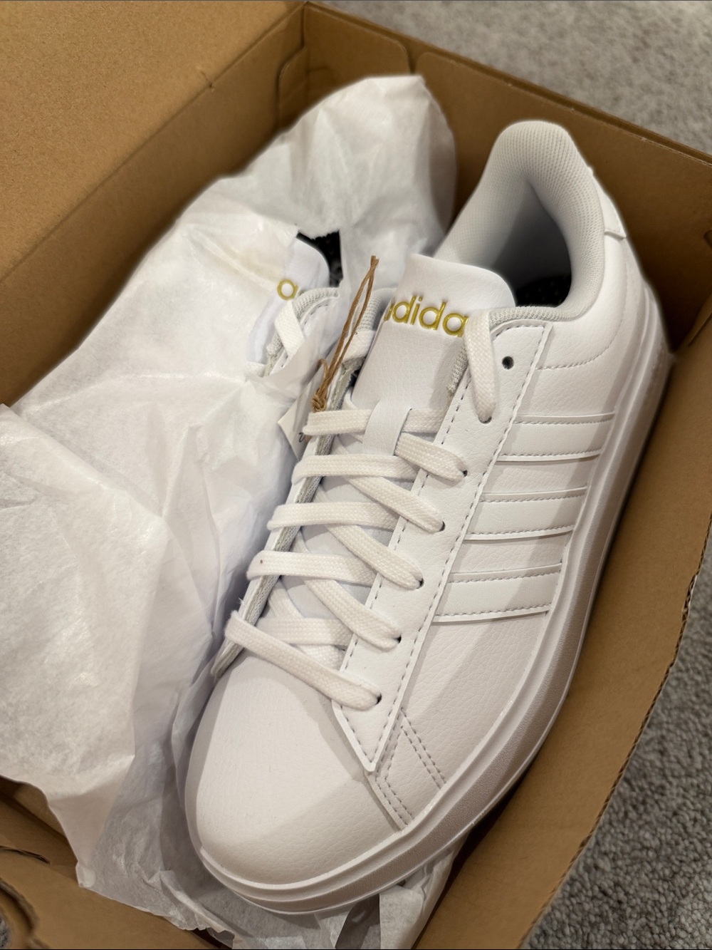 adidas White Low-Top Sneakers with Gold Logo Accent